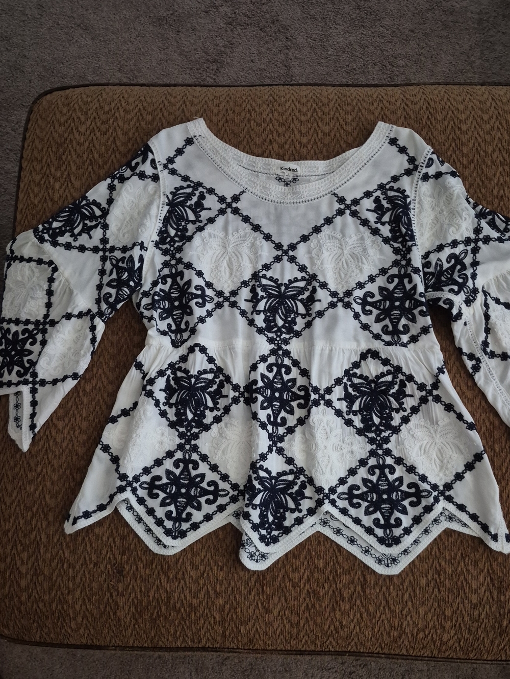 Embroidered White Peplum Blouse with Navy Black Motif